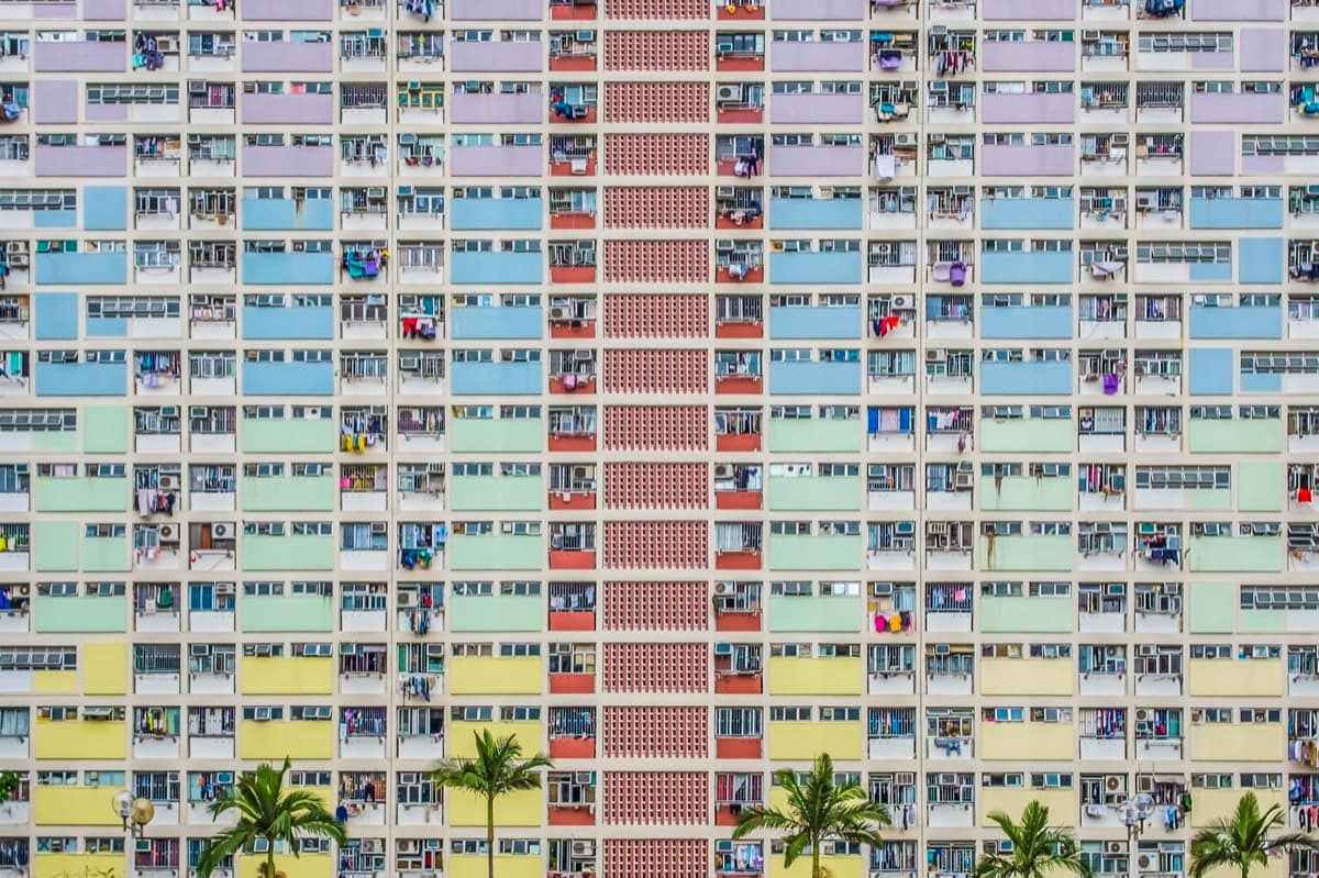 Colorful facade of Choi Hung public housing estate with pastel-coloured panels