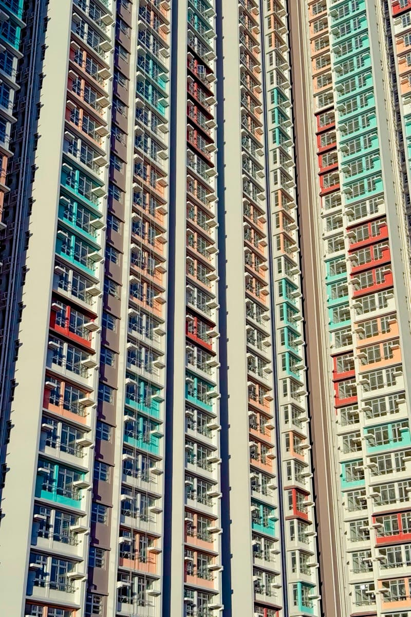 Abstract pattern of colourful apartment balconies shot at a steep diagonal angle