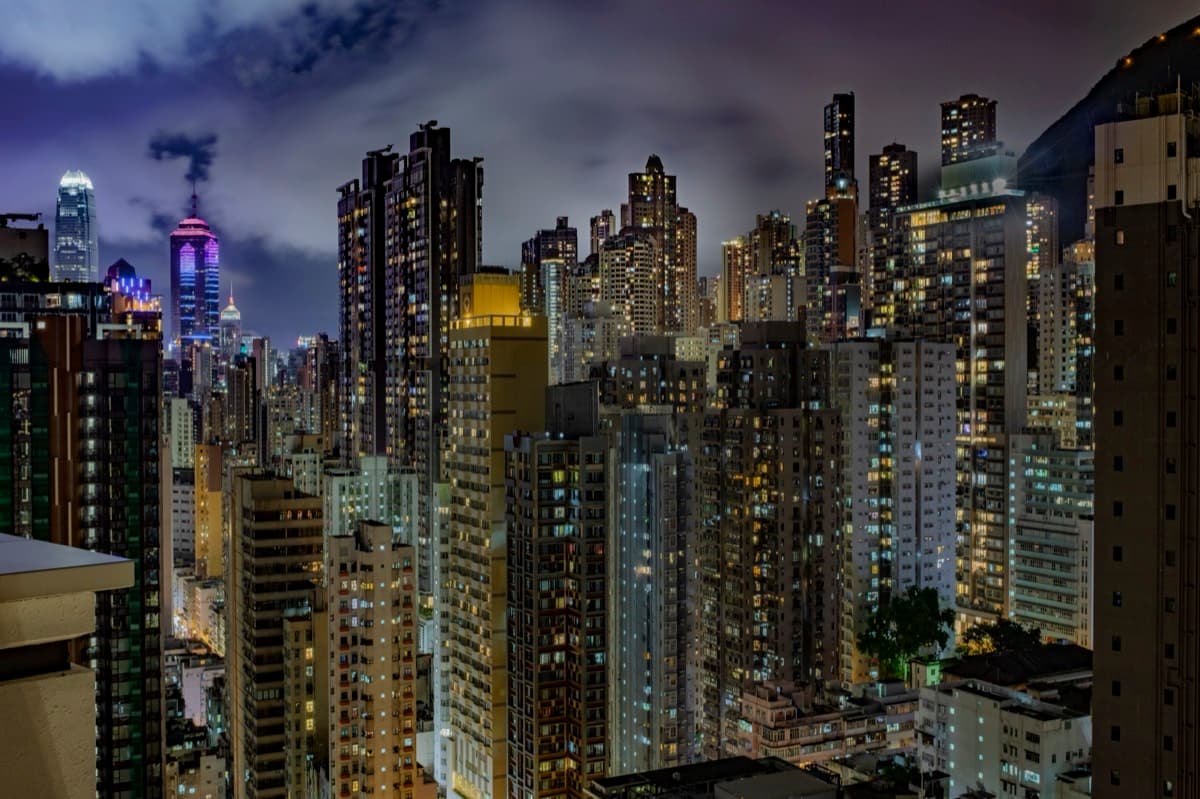 Sweeping nighttime cityscape of Hong Kong residential and office towers