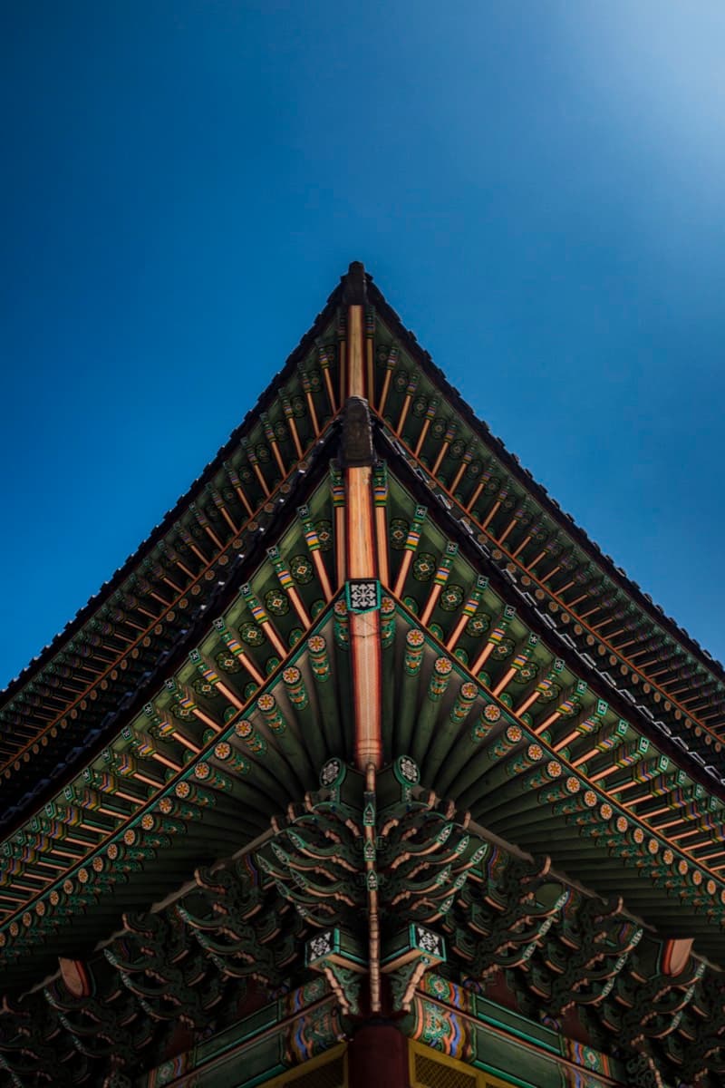 Ornate Korean palace roof with green, red, and gold dancheong decorative painting